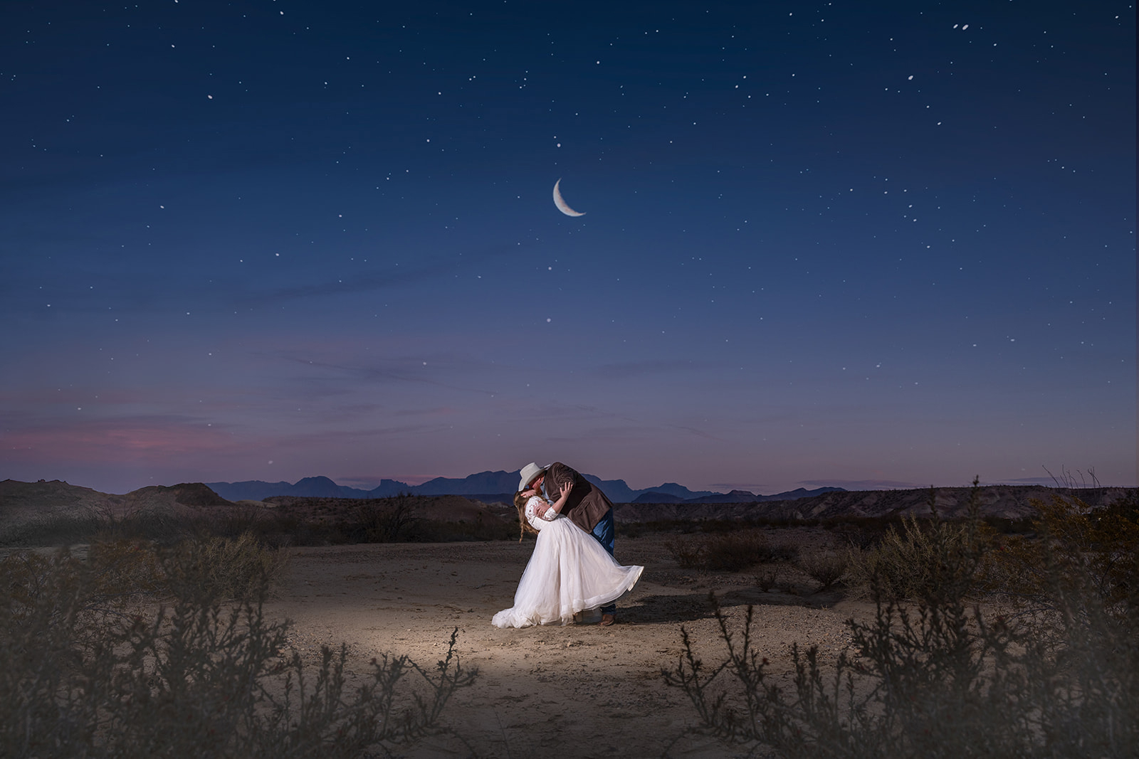 ride and groom share their first dance reflected through bar glassware at Club Charles in downtown Kerrville, Texas—award-winning photo by Gabe Rene LLC